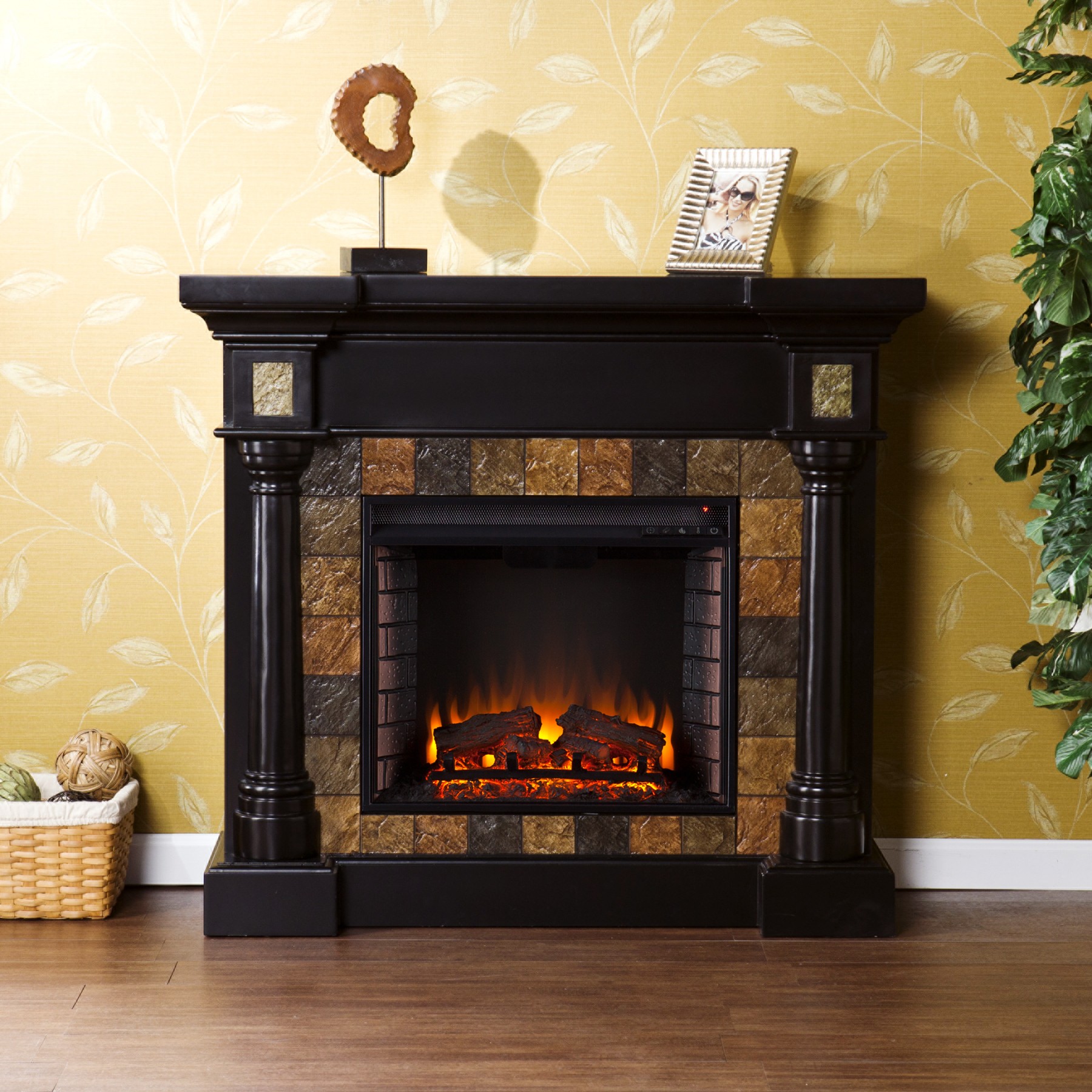 Carrington Faux Slate Convertible Electric Fireplace - Blac Dark earth tone faux slate tiles surround the firebox on Weatherford Convertible Electric Fireplace-Black black fireplace mantel to create a look that is unbeatable. Rounded columns on either side of the firebox are topped off with square tiles
